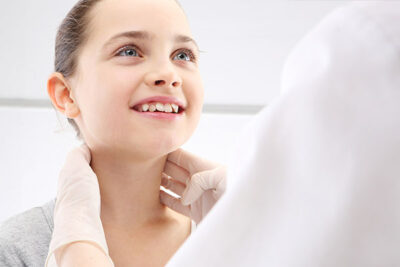 Doctor Checking Child's Lymph Nodes