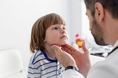 Pediatric Doctor Checking Child's Neck Mass
